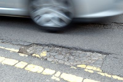 Government pledges to get tough on UK councils over pothole failures