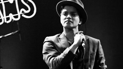 For 9 years, people said a gambling debt kept Bruno Mars trapped on a Las Vegas stage. He just finally broke his silence on it.