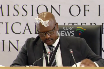 Corruption inquiry interrupted as ex-police chief gets tissue stuck on his head