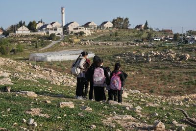 Israeli settlers block Palestinian kids' path to school with tear gas and barbed wire