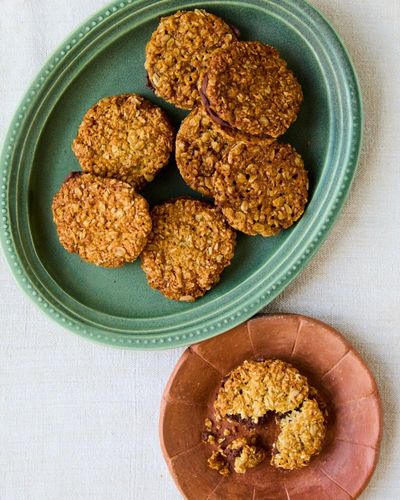 Helen Goh’s recipe for Anzac sandwich biscuits with dark chocolate filling