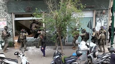 Italy: 25 hostages freed as Naples bank gang vanishes underground