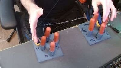 Crazed World of Warcraft gamer plays game with 3D-printed hot dog controller — the left wiener quad-array controls movement, the right triggers abilities