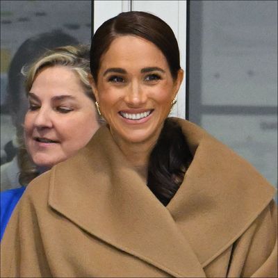 Meghan Markle Combines the Sleeveless Turtleneck and Trench Coat Trends for an Australia Outing With Prince Harry