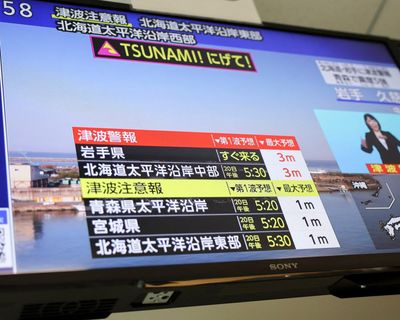 Japan tsunami alerts downgraded following powerful earthquake off northern coast – as it happened
