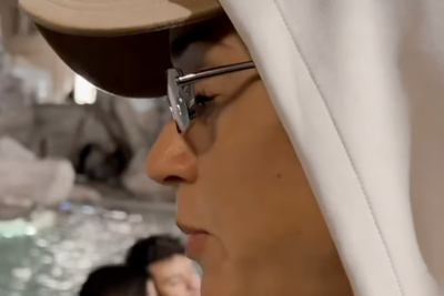 Katy Perry tosses bank card into iconic Rome monument