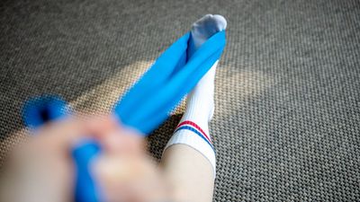 A physical therapist recommends this 15-minute resistance band routine to build strong ankles and reduce your risk of injury