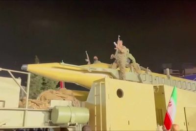 Iran shows off what appears to be a ballistic missile at Tehran rally