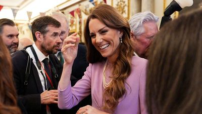 Kate Middleton puts her own spin on Queen Elizabeth's iconic style with dusty lilac dress at palace reception