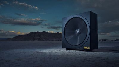 That's not a sub, THIS is a sub — Deus Audio's 60-inch infrasonic bass driver is nearly 6 feet tall, can hit 8Hz, and handles 20,000W of power. This would be the ultimate home theater upgrade…