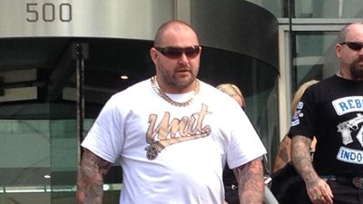 Sniper who gunned down bikie boss unmasked by court