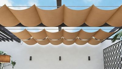 This Retractable Sun Sail Is a Chic, Affordable, and Easy Way to Bring Peace and Shade to Your Garden (Plus It Screens Nosy Neighbors From Above)