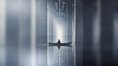 "On that foggy morning, a person rowed a boat and was about to cross under the bridge. I immediately chased after him along the shore," says award-winning photographer