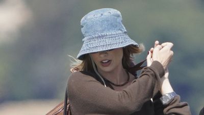 Margot Robbie's denim bucket hat, baggy jeans and suede loafers look is so chic for sunny but windy weather