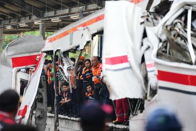 Rescuers recover victims from an Indonesia train crash, in photos