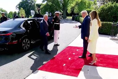 Trump greets the King with a firm handshake as royals visit White House