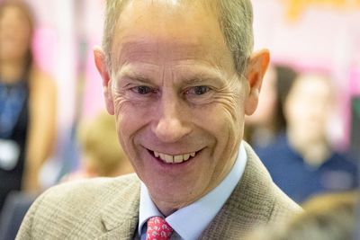 Duke of Edinburgh visits old school to present pipe band with royal banner