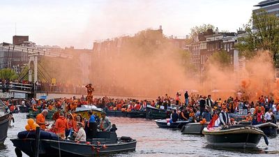Thousands filled Amsterdam’s streets and canals to celebrate the king’s birthday