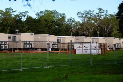 Evacuees from flooded remote Indigenous areas in NT housed in compound likened to ‘a prison camp’
