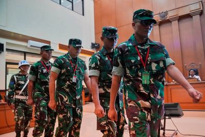 Trial begins for 4 Indonesian service members charged over acid attack on activist