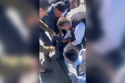 Man pinned to ground in handcuffs after stabbing attack in Golders Green