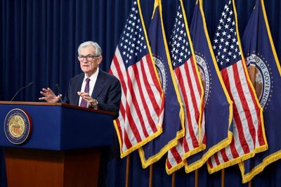Jerome Powell to stay on Fed board after central bank holds rates steady in defiance of Trump