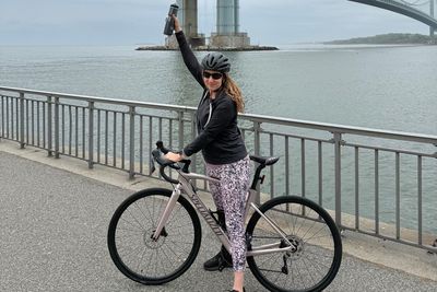 ‘We put training wheels on my bike to start and my husband walked next to me playing Eye Of The Tiger the whole time’: Traumatic brain injury survivor returns to cycling at closed road event