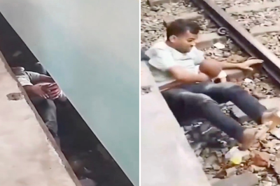 Father shields child underneath moving train in Bangladesh