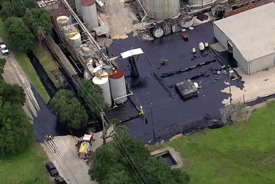 Worker dies trapped three feet under asphalt after tank explosion