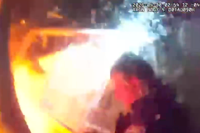Police blown off their feet by explosion before getting up and rescuing children from smoldering ruins