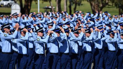 Police force under scrutiny swells ranks with recruits