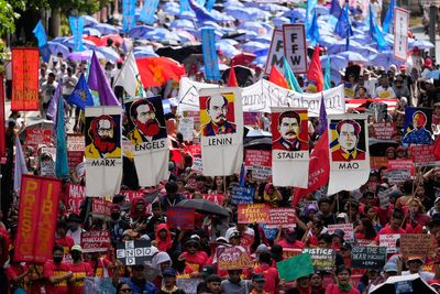 Workers around the world demonstrate on May Day, in photos