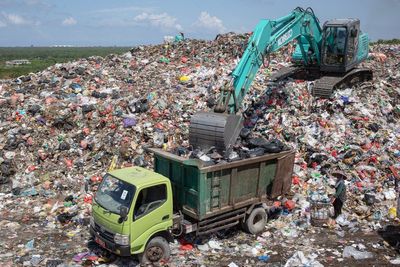 Garbage piles up in Bali after restrictions on resort island’s largest landfill disrupt collection
