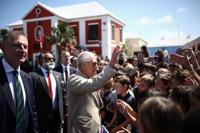 Hundreds of school children and islanders welcome the King to Bermuda