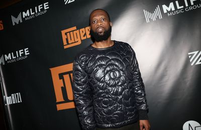 Fugees rapper Pras Michel turns himself in for 14-year prison sentence but will still appeal