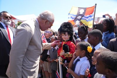 King Charles mobbed by hundreds of school children and islanders in historic Bermuda visit