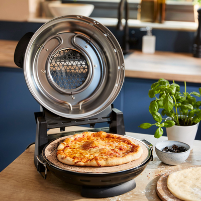 A new small-kitchen-friendly indoor pizza oven from Kenwood just dropped – and the price tag is so much more appealing than you'd expect
