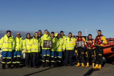 Lifeboat crew honoured after dog falls into sea from harbour wall