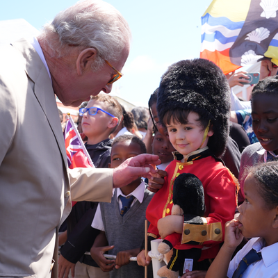 Why King Charles Was Bemused by One Young Royal Fan's Festive Outfit During His Visit to Bermuda