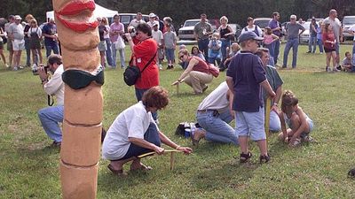 Participants compete to lure worms from the ground at quirky UK festival