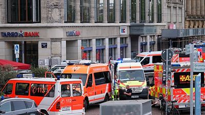 Mourners lay flowers and candles in Leipzig after deadly car rampage