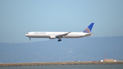 221 passengers on United Flight 169 walked away unharmed after crash, but the truck driver caught under its landing gear didn’t