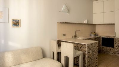 This Tiny Apartment in Barcelona Uses the Same Memphis-Inspired Wood in Every Room — And It Gives Its Pared-Back Scheme Such a Sense of Personality