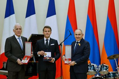 Macron croons classic ballads at a state dinner in Armenia for the French leader