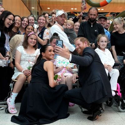 Buckingham Palace Says Meghan Markle and Prince Harry’s Australia Visit Is “Pretty Outrageous Behavior”—But Does It Really Matter?