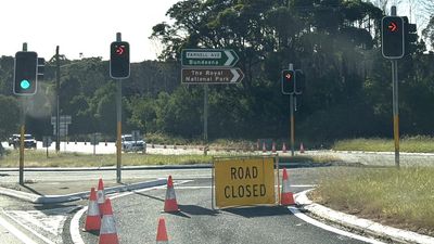 Two charged after car plunges into weir in fatal crash