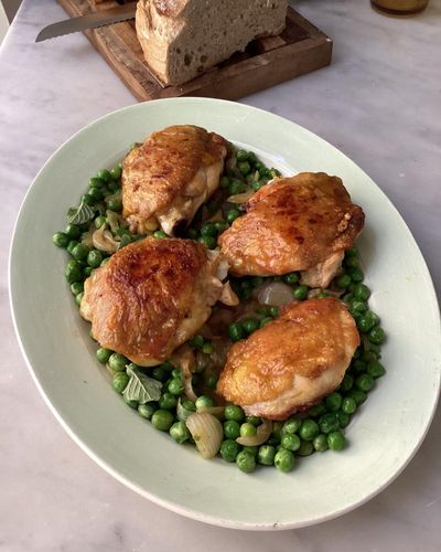 Rachel Roddy’s recipe for spring chicken thighs with spring onions, mint and peas