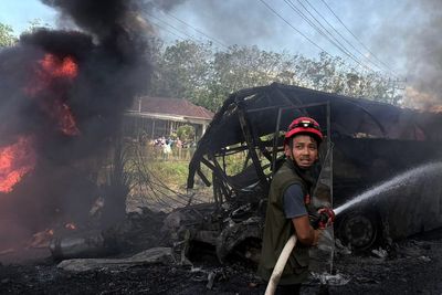 At least 16 killed in collision between passenger bus and truck in Indonesia