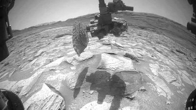 Watch NASA's Curiosity rover 'struggle' to remove a rock that got stuck on its robotic arm for nearly a week