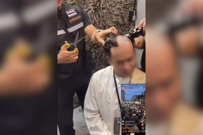 Muslim crowd shaves man's head after he mocks the Koran